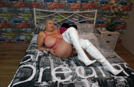 Bold granny Savana in thigh poses in fishnet body stocking & thigh high boots
