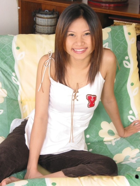 Adorable Asian young adult showing off her beautiful hairy femininity and spreading
