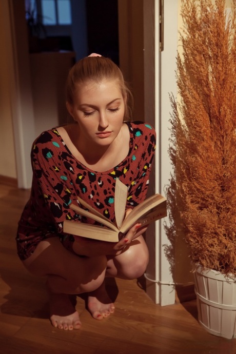 Natural redhead Bretona flashes a natural upskirt & squats artistic with legs spread