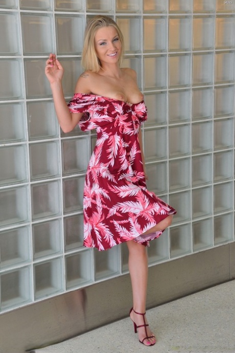 Beautiful blonde young adult spreading femininity wide open for intimacy toy insertion