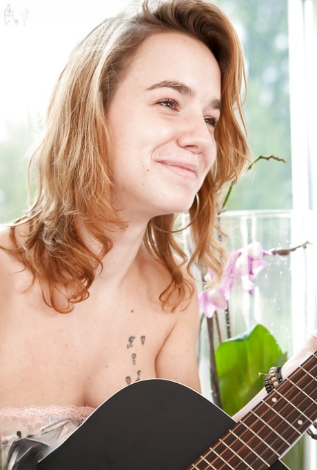 Young adult cutie Aletta with pretty panties and curves peaking out from under shorts