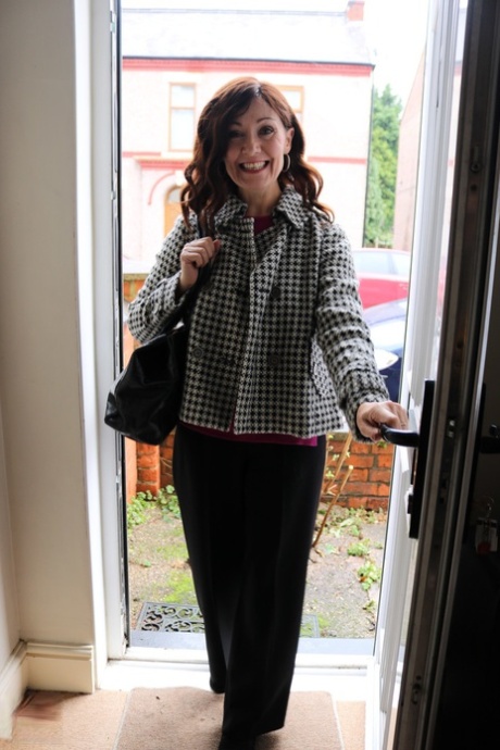 Alluring MATURE WOMAN Kitty Cream models for a non-nude shoot while at home and alone