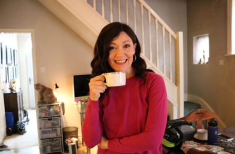 Alluring MATURE WOMAN Kitty Cream models for a non-nude shoot while at home and alone