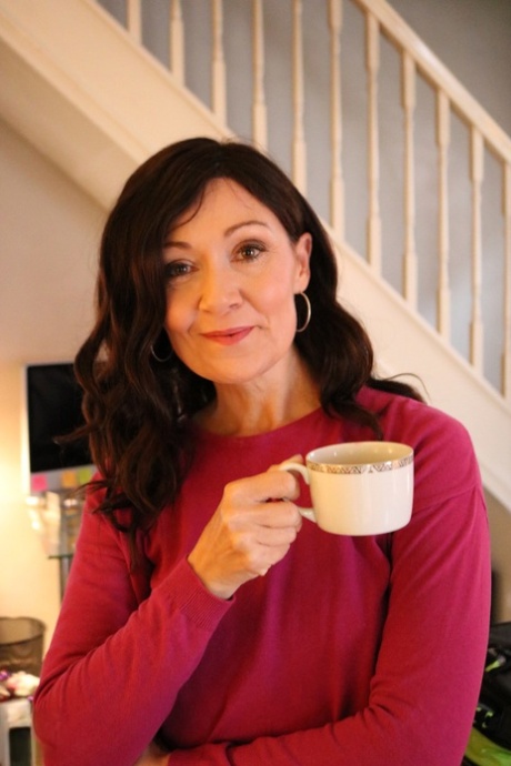 Alluring MATURE WOMAN Kitty Cream models for a non-nude shoot while at home and alone