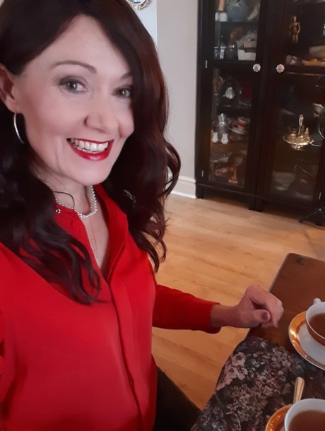 Alluring MATURE WOMAN Kitty Cream models for a non-nude shoot while at home and alone