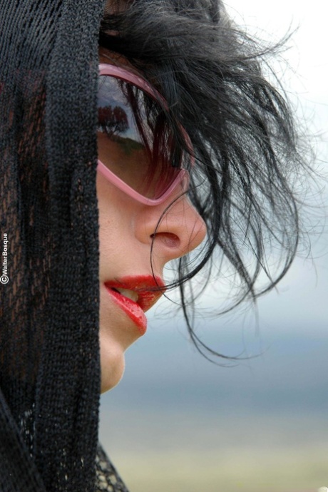 Alluring model with sunglasses Tacha showing off her attractive body in black boots