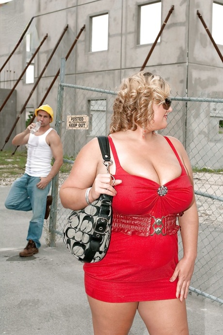Busty blond bbw in red skirt gets caressed and kissed by a construction worker