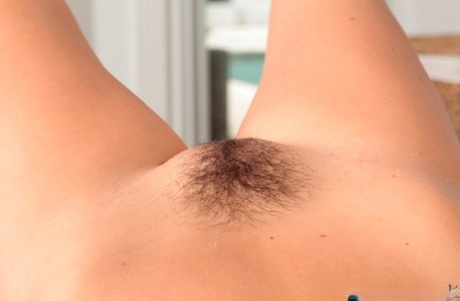 Clothed young adult babe Bailey Bae posing in high heels and short skirt