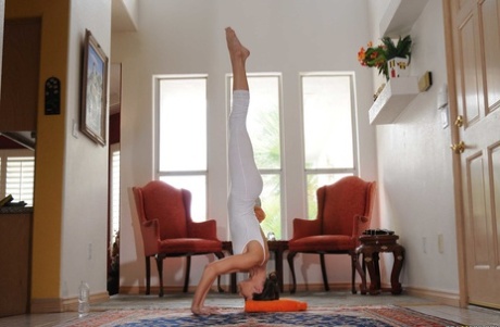 Long legged brunette Jenni Lee stripping down natural and stretching