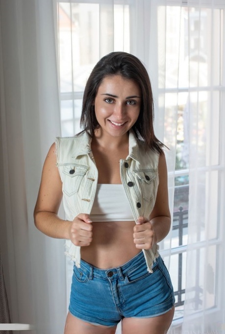 Nice young adult Dionisia puts the focus on her tight slit as she strips natural