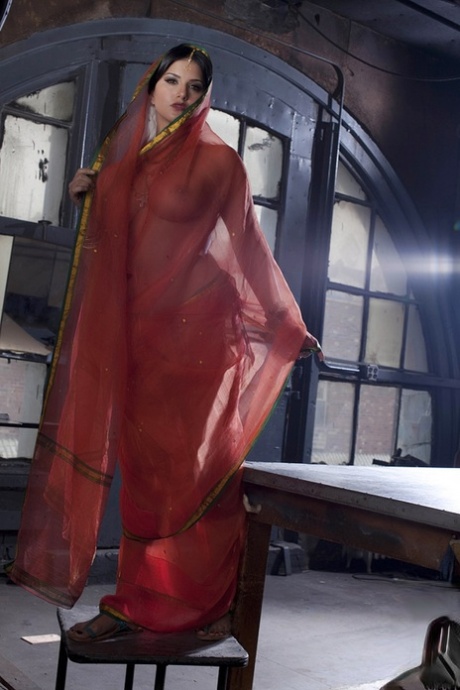 Busty solo girl Sunny Leone models solo in see thru Indian attire