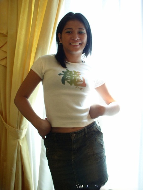 Young looking Asian girls undress on their bed for same-sex female intimacy