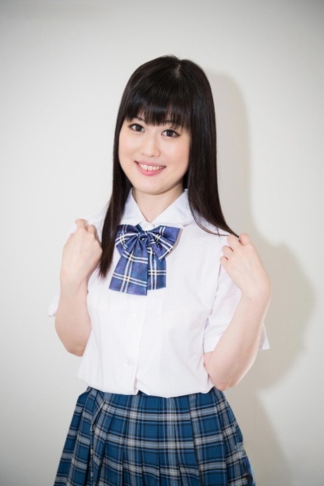 Japanese schoolgirl in socks and skirt chokes on a manhood during a face fucking