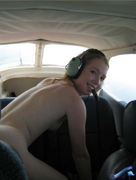 Natural redhead Nicki Blue gets totally natural aboard a small engine aircraft