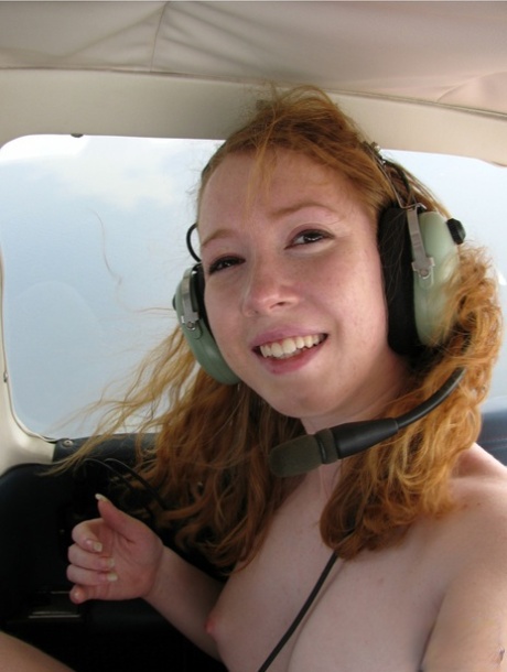 Natural redhead Nicki Blue gets totally natural aboard a small engine aircraft