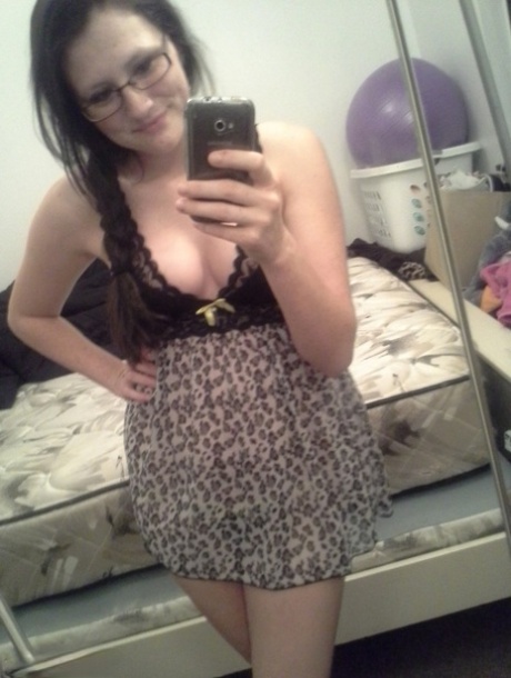 Geeky brunette Freckles 18 touches her attractive breasts in her solo homemade session