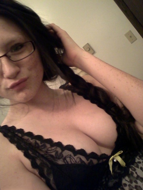 Geeky brunette Freckles 18 touches her attractive breasts in her solo homemade session