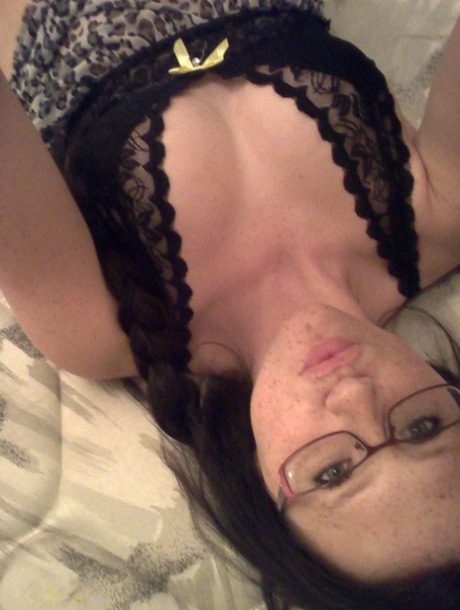 Geeky brunette Freckles 18 touches her attractive breasts in her solo homemade session