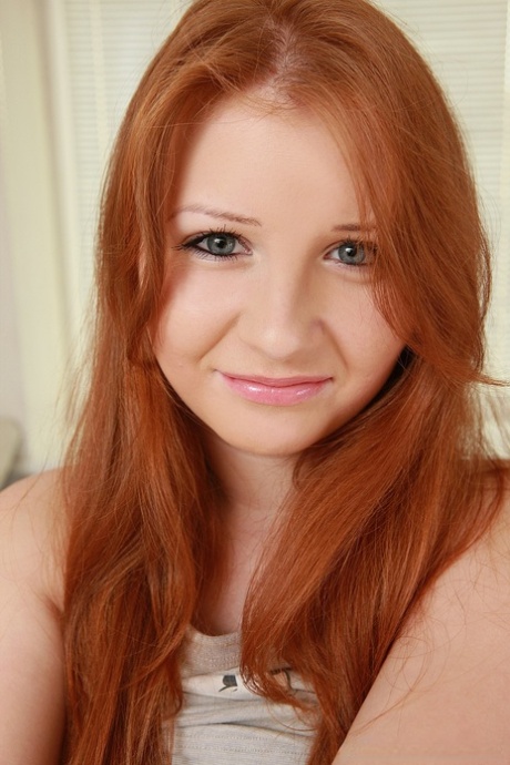 Innocent redhead Jess shows her big breasts and masturbates with a dildo