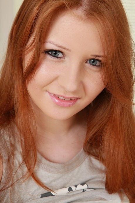 Innocent redhead Jess shows her big breasts and masturbates with a dildo