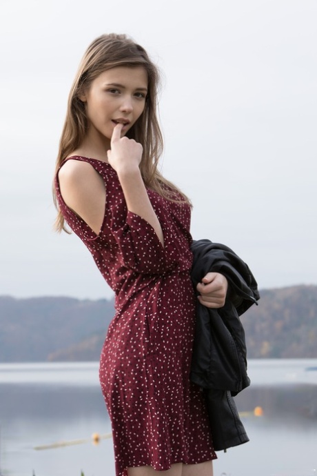 Naughty young adult Mila Azul shows her beautiful breasts & her shaved femininity outdoors