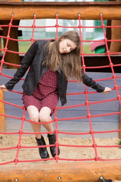 Naughty young adult Mila Azul shows her beautiful breasts & her shaved femininity outdoors