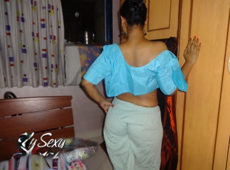 Indian solo girl Lily Singh exposes her natural breasts in a skirt