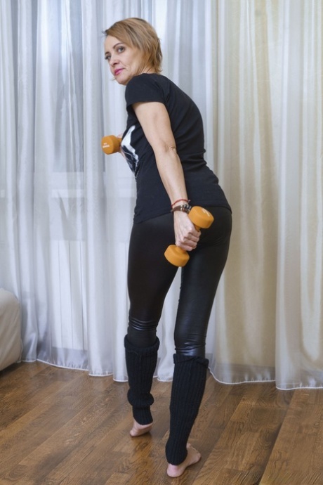 Mature woman Ivanna exposes her tiny breasts and flaunts her hairy muff