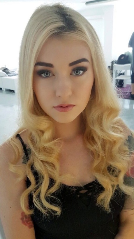 Beautiful blonde slut Misha Cross takes a selfie fully clothed and stark natural