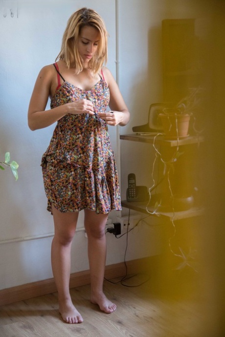 Natural white chick pulls on her bra and panties as she gets dressed