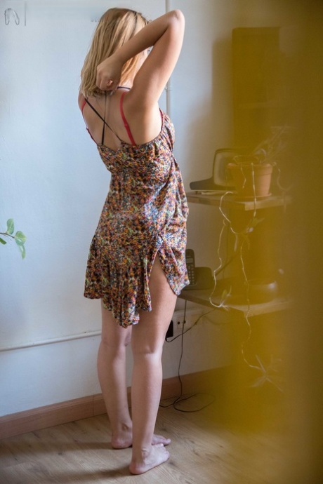 Natural white chick pulls on her bra and panties as she gets dressed