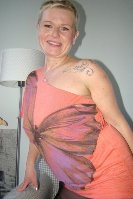 Happy alluring mature Deide Jones rips pantyhose to reveal butterfly femininity