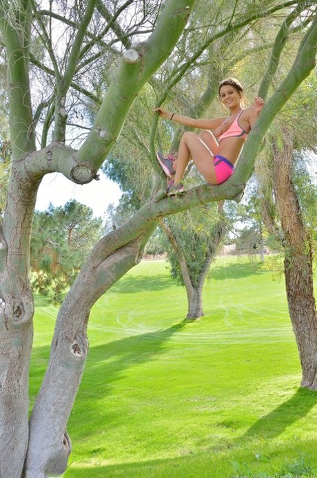 Petite blue-eyed brunette Lana strikes alluring artistic poses outdoors