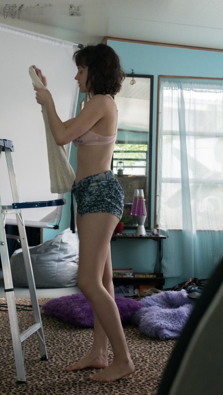 Slender Charlee shows nice breasts and thick underarm hair while getting dressed