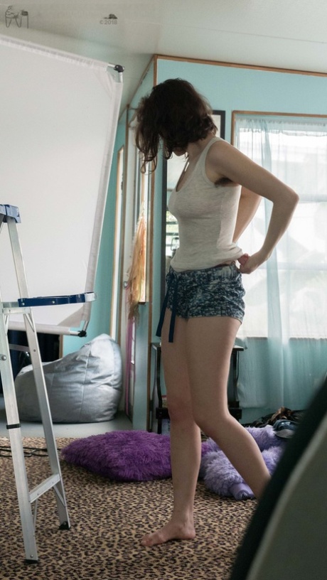 Slender Charlee shows nice breasts and thick underarm hair while getting dressed