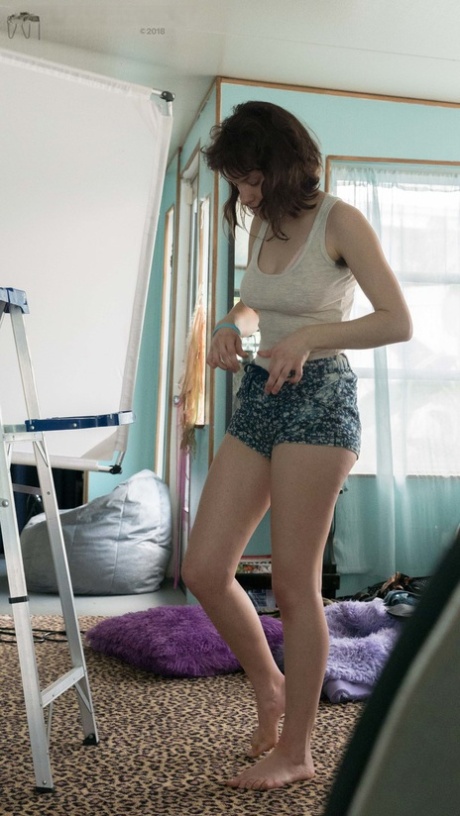 Slender Charlee shows nice breasts and thick underarm hair while getting dressed