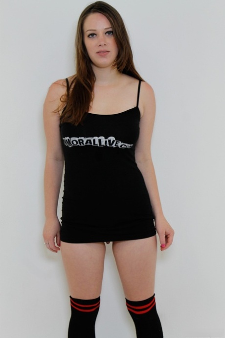 White girl Natalie Moore wears a smile while stripping to over the knee socks