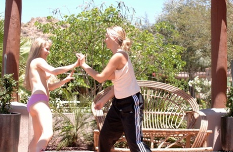 Cutie in pink panties Fiona Luv fights with busty Alison outdoors