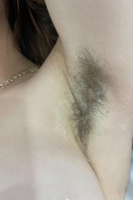 Authentic Fiona Sprouts shows her breasts & hairy armpits & spreads her bald cunt