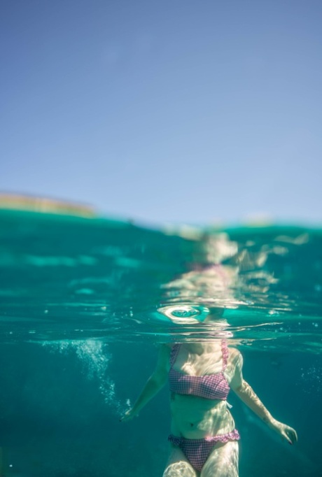 Chubby authentic MATURE WOMAN Mackenzie Page poses in her lingerie & teases a young adult boy