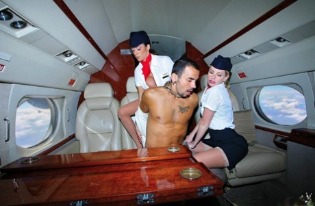 Alluring flight attendants in stockings fucking first class passanger