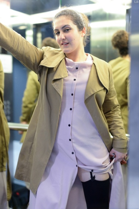 Cute authentic mom Lili flashes her muff as she poses pantyless in public