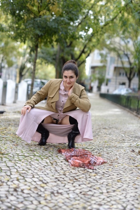 Cute authentic mom Lili flashes her muff as she poses pantyless in public