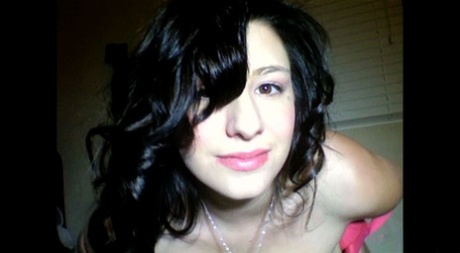 Attractive babe September Carrino shows her femininity and her big breasts