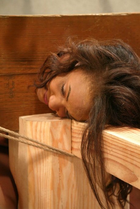 Busty ebony bondage slave Sinnamon Love gets her femininity toyed while tied up