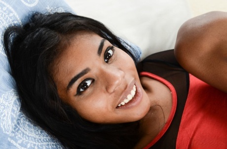 Attractive ebony Nia Nacci gives a closeup of her alluring shaved femininity & asshole