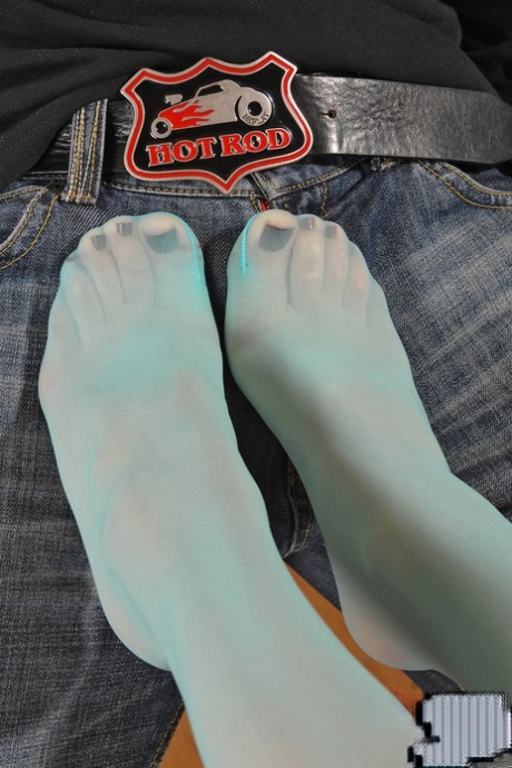 Hungarian hottie Kitty Cat gets her stockings stripped before giving a footjob