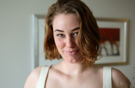 Australian housewife Molly Broad pets her femininity during artistic modeling premiere