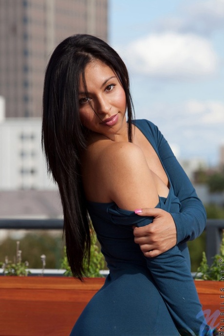 Very alluring Latina in tight dress and boots shows her smooth femininity in public