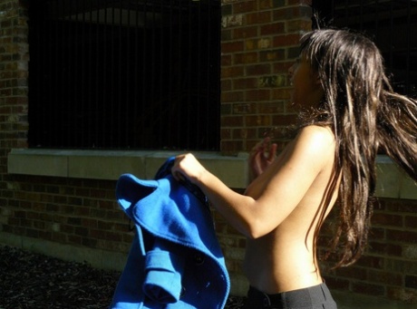 Ebony chick fingers her femininity on roadway while a jogger passes by